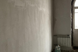 Mechanized plaster walls in the apartment. Moscow